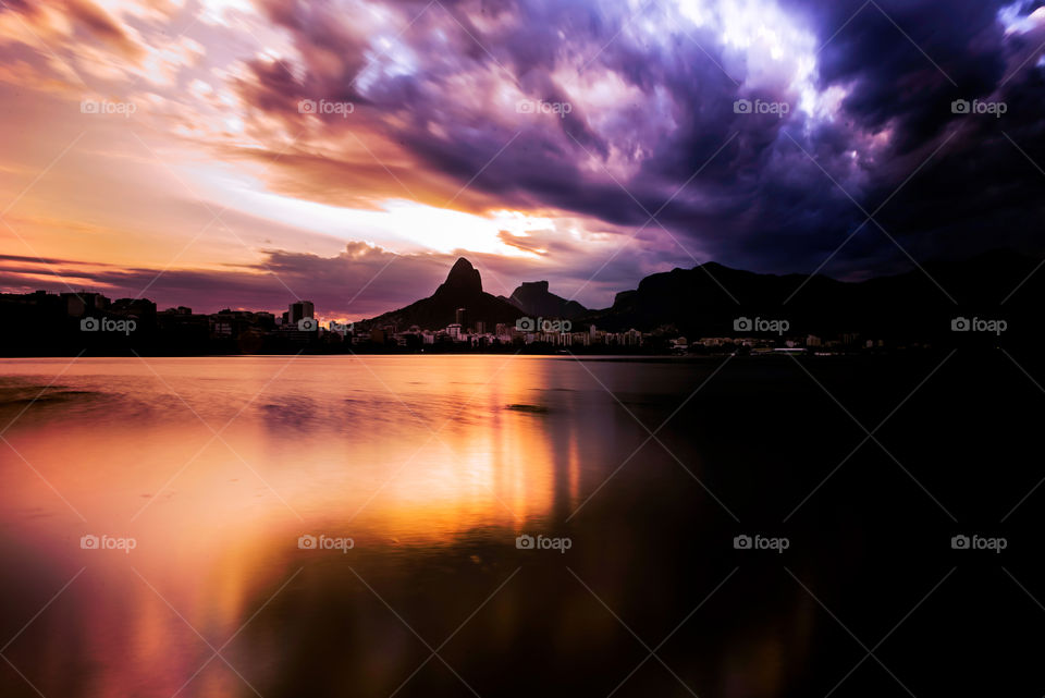 Reflection of storm cloud and dramatic sky at sunset