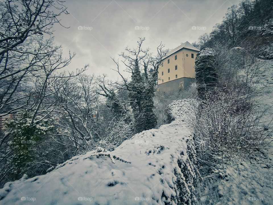 Old building on the snowy hill