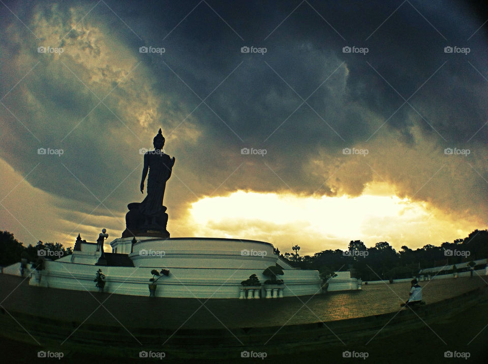 sunset statue religion silhouette by wacharapol
