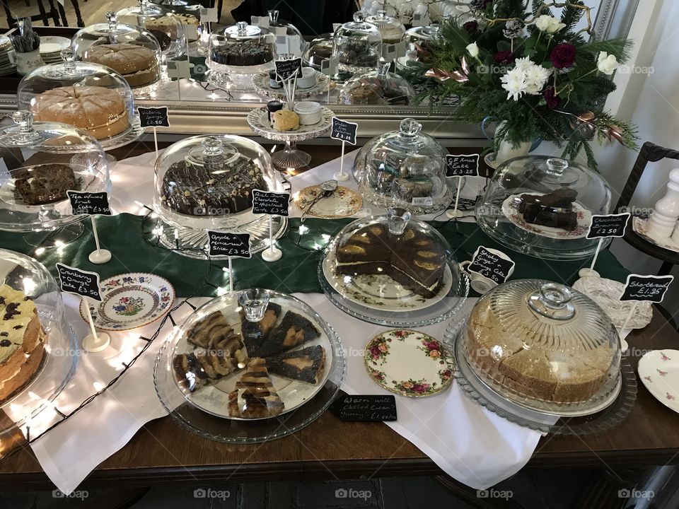 Table crammed packed with delicious cakes and pastries.