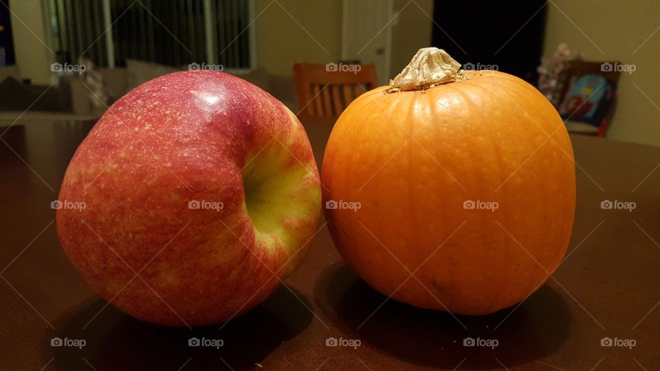 Apple and pumpkin of same size