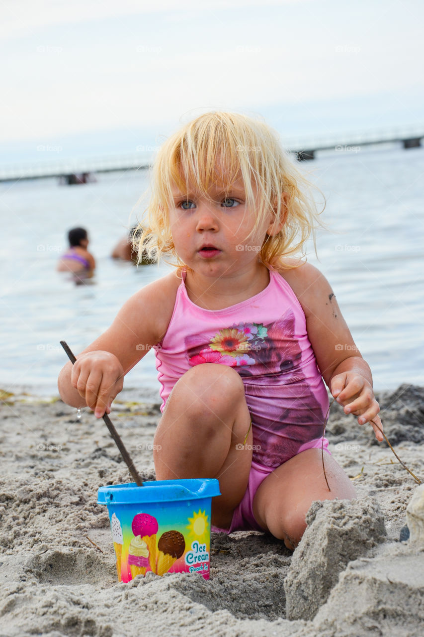 Girl playing with sand