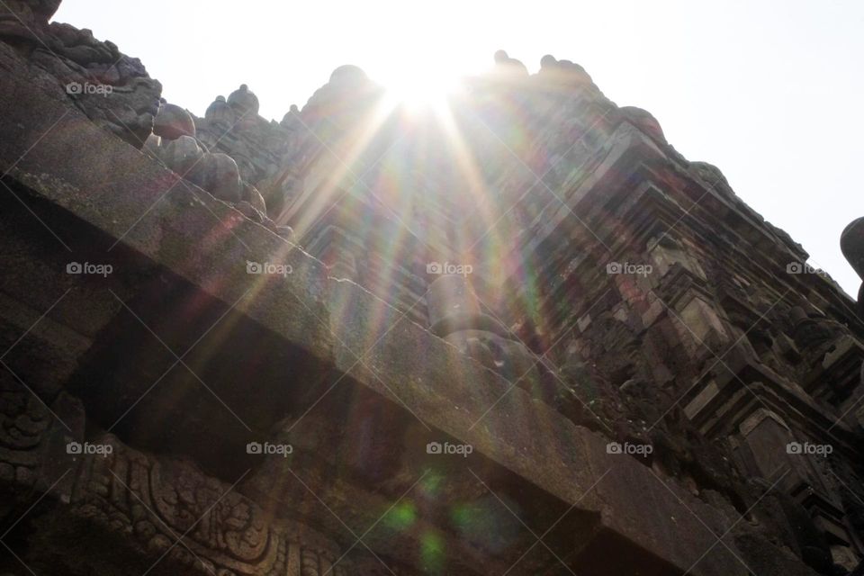 The morning sun shines on the corner of Prambanan temple, Central Java.