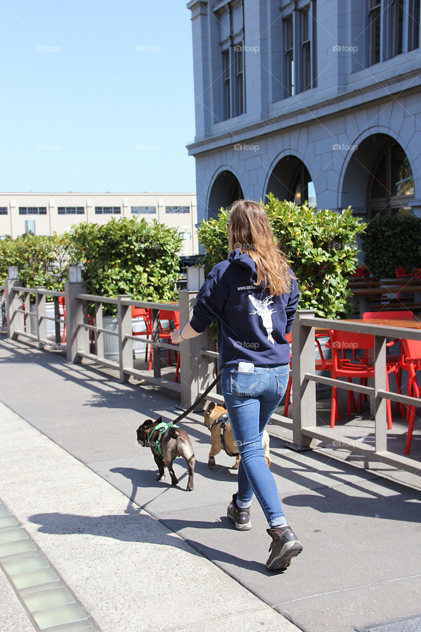 Girl walking with dogs