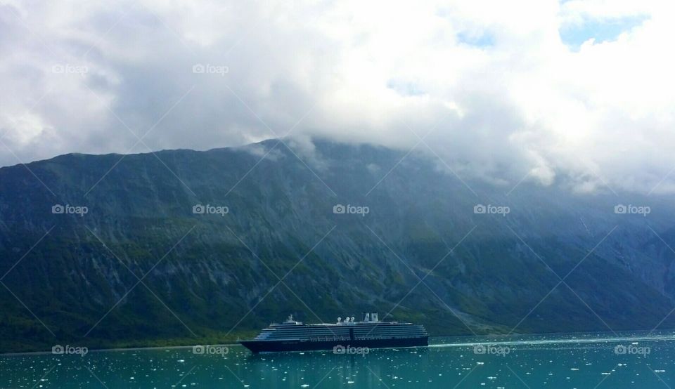 Glacier Bay National Park 
Beath taking mountains with a cruise ship sailing through the water.
Alaska