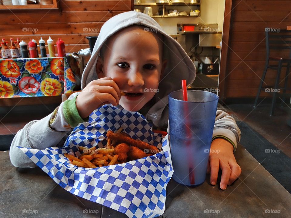 Child Eating French Fries
