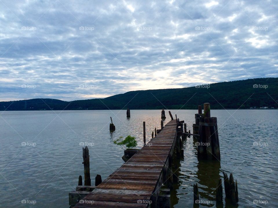Abandoned pier on Hudson River. An abandoned pier in the early evening at Charles Point on the Hudson near Peekskill, NY