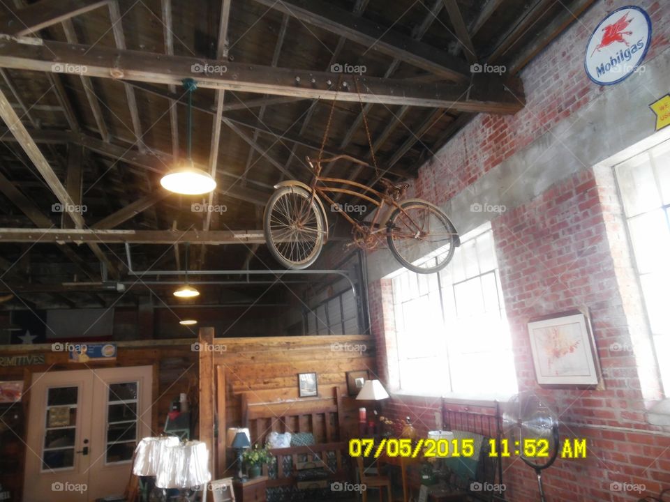 Mary Poppins last ride 2. This is another picture of the same bicycle 🚲 hanging from the ceiling in a gift shop in Graham Texas