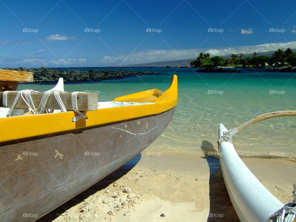 His and Her Hawaiian Boat. Double hulled kayaks on a beach on the Big Island of Hawaii