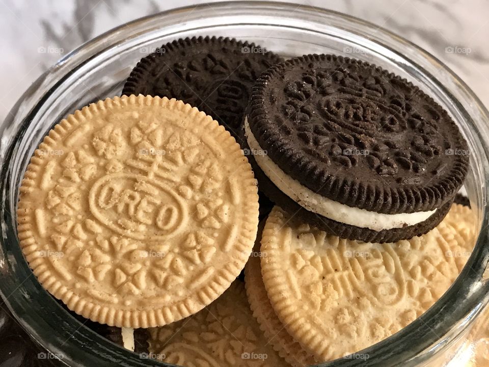 Building and chocolate Oreo double stuff cookies and a cookie jar