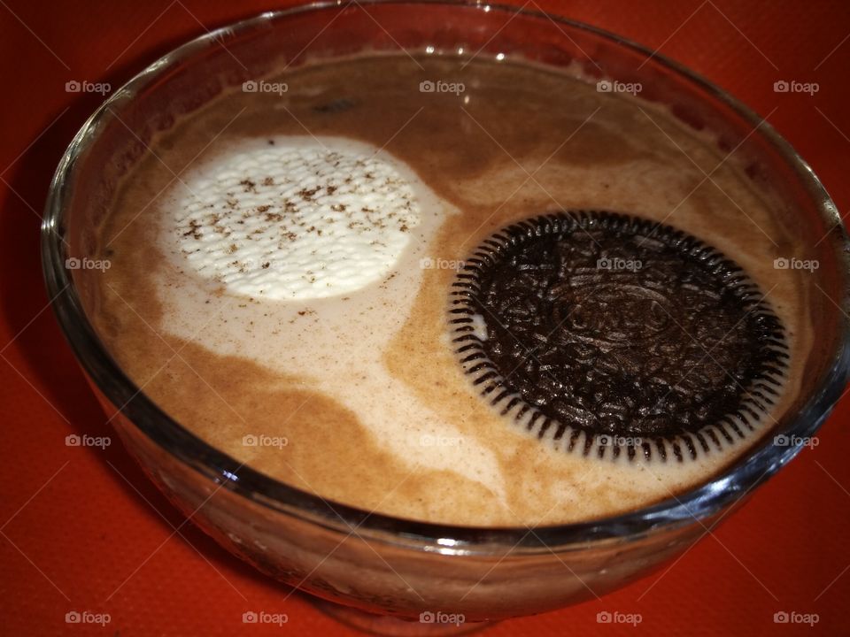 chocolate, cookie, filled with white cream, crean, milk, whitr and black, liquid