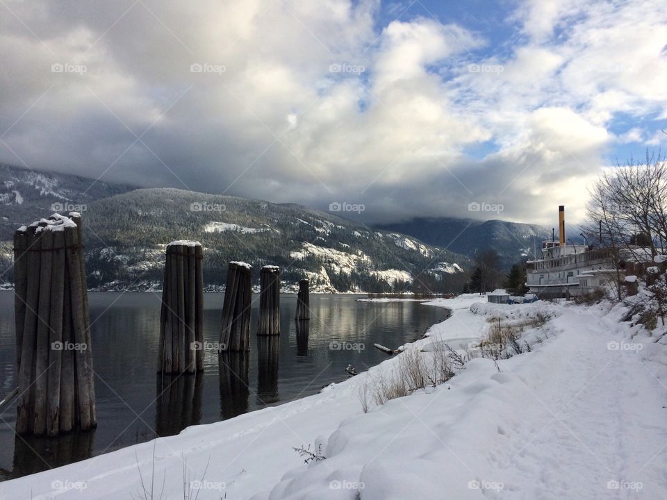 Paddle wheeler beside a mountain lake 