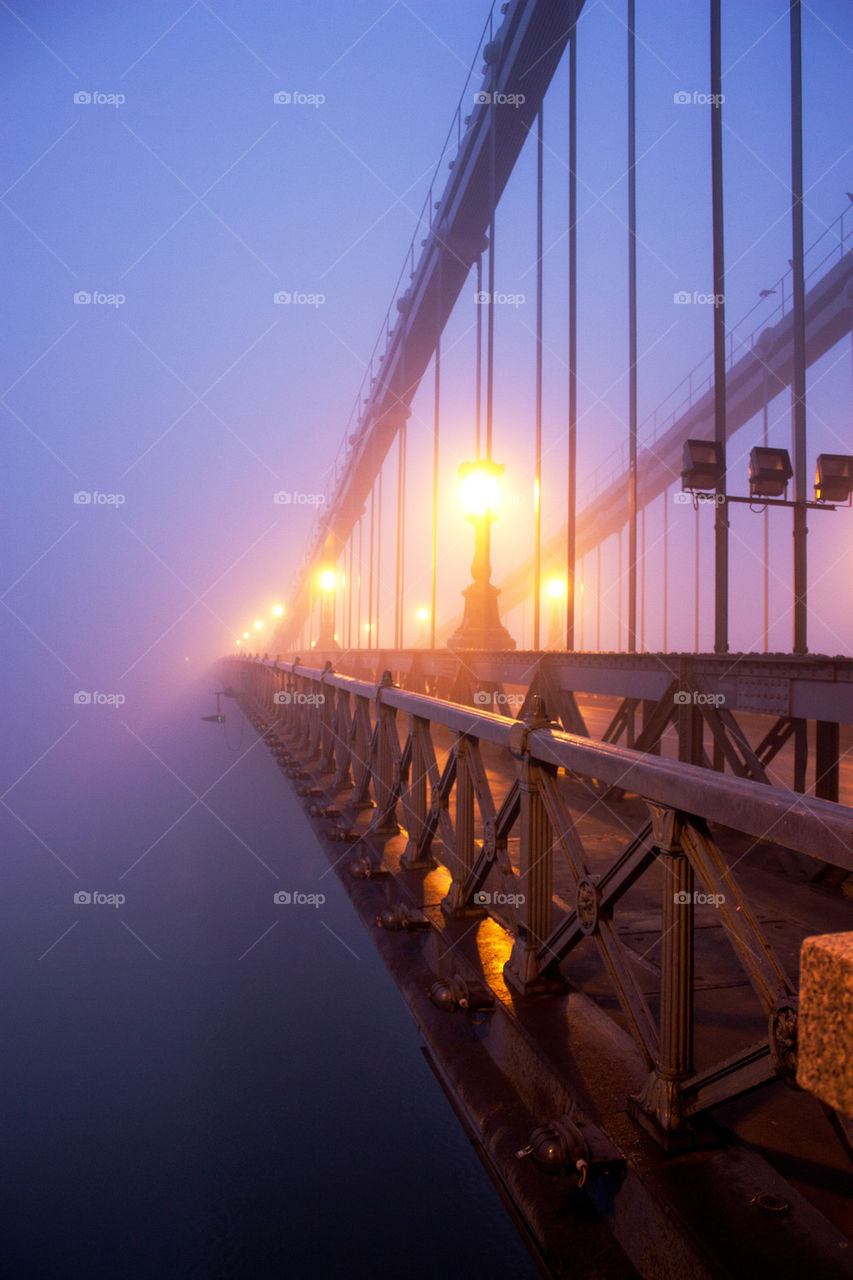 Chain bridge in fog
