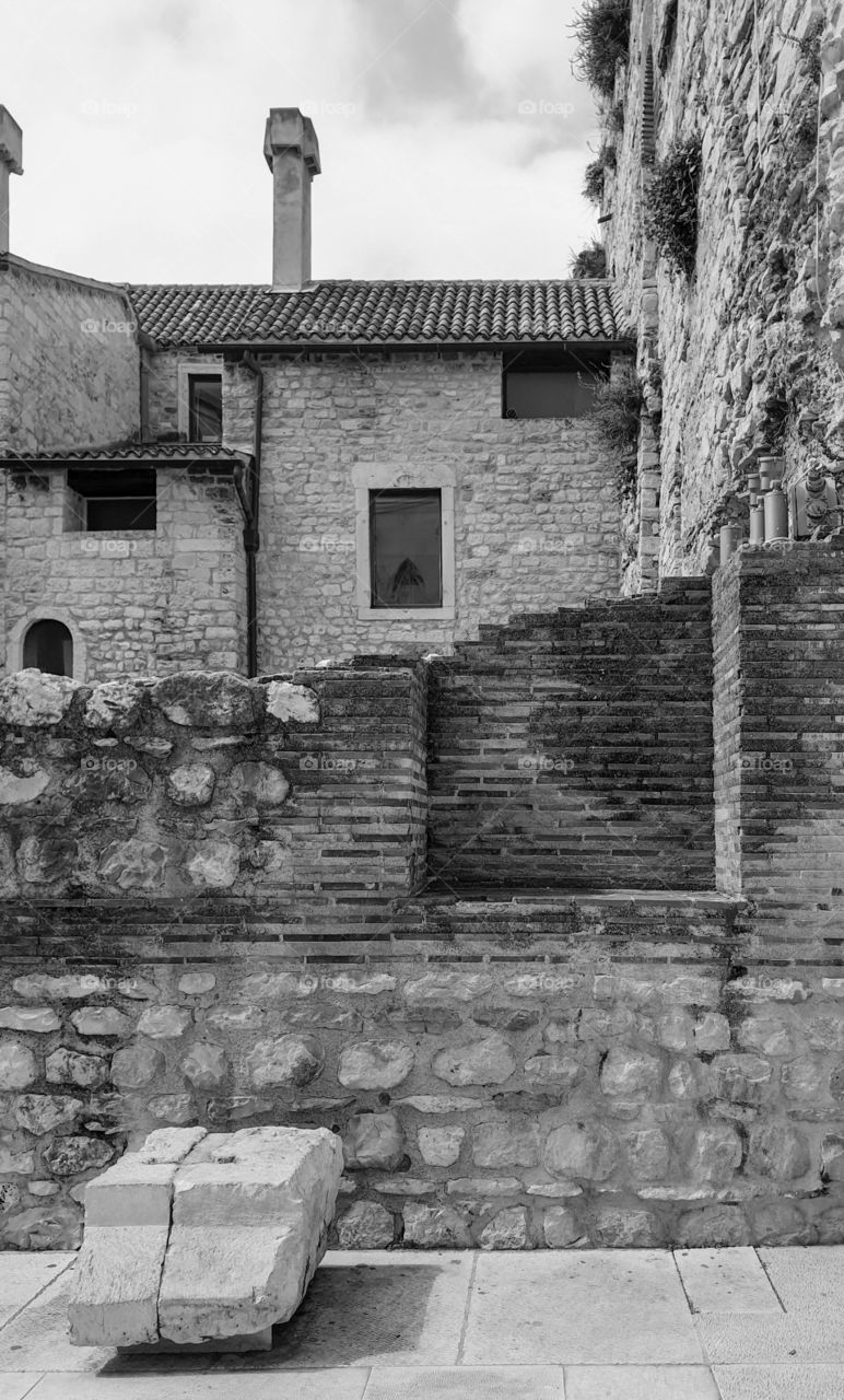 Monochrome city landscape: summer, an old stone city with destroyed brick walls.  Dolmatia, Split, Diocletian's Palace, residential part