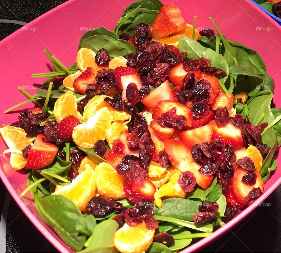 Healthy salad spinach cranberries clementine strawberries 