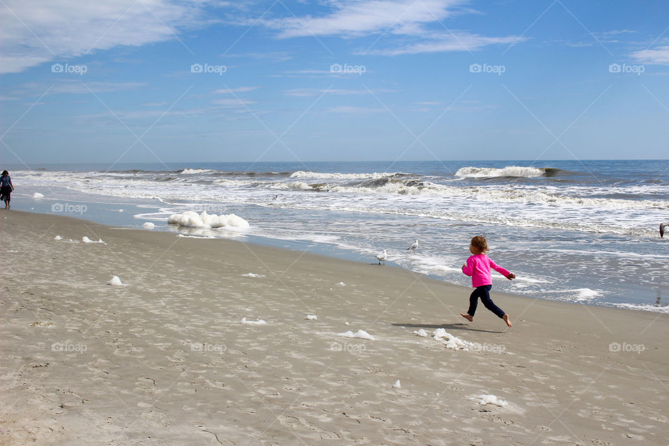 Child running at the beach