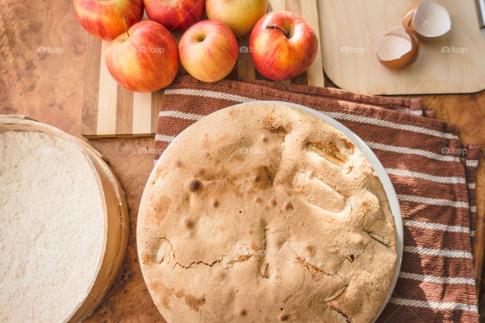 Making homemade puffed apple pie with eggs, sugar and flour.