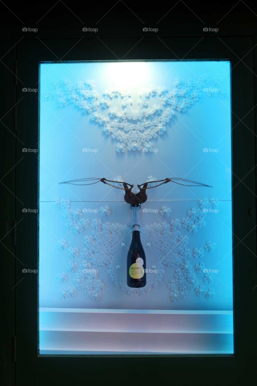 presentation of a wine bottle in a display window. heavenly pleasure