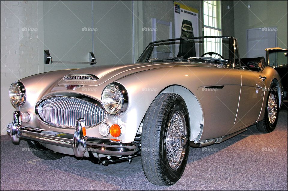 Classic Car Austin Healy. Gorgeous silver 1964 Austin Healy convertible 2 door coupe. Spoke rims, red interior and showroom condition.
Fleetphoto