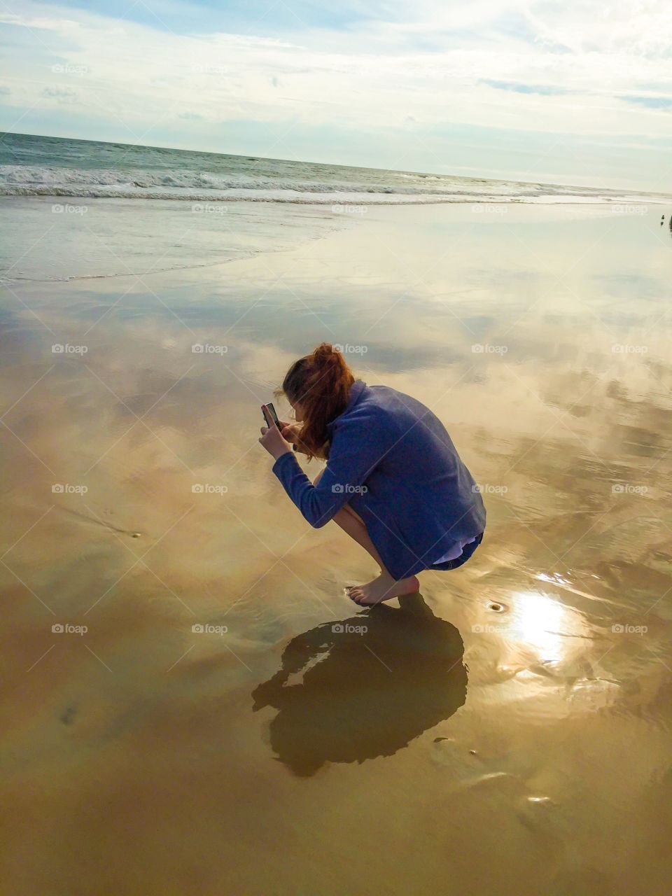 Finding something interesting in the smooth glassy waters