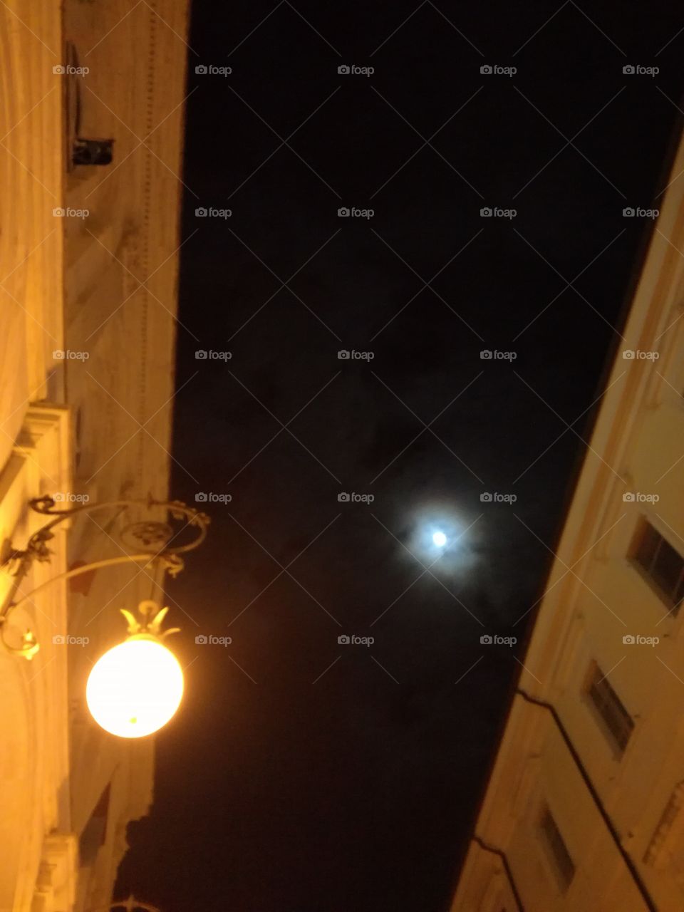 The moon and the lamp outside the theather