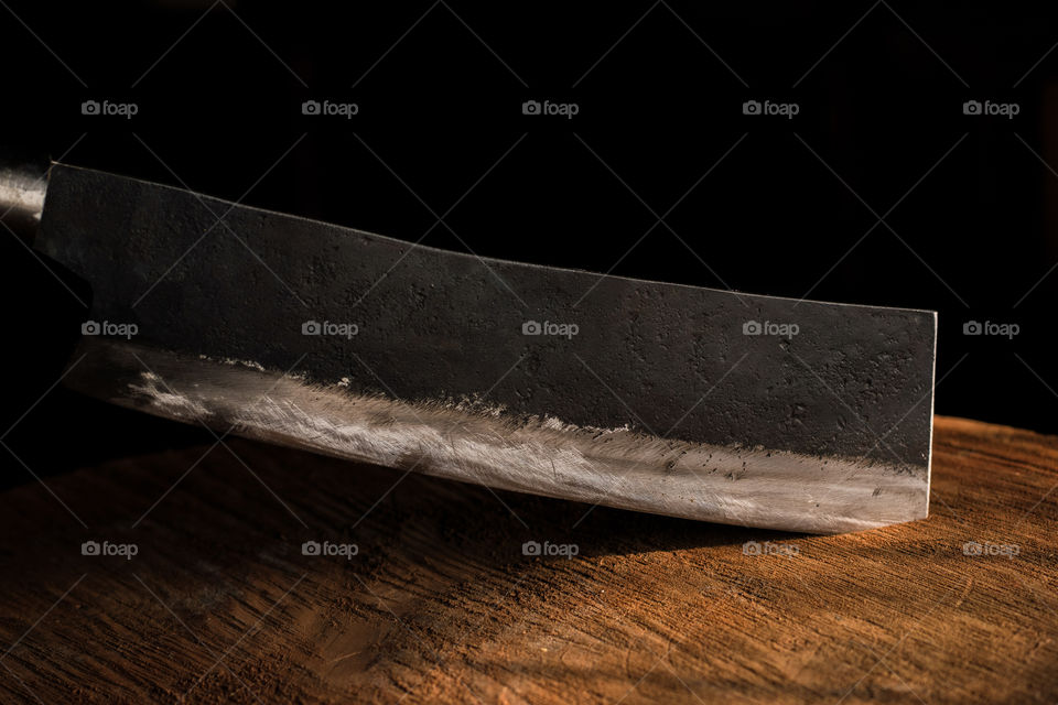 A traditionally forged in fire chopper knife