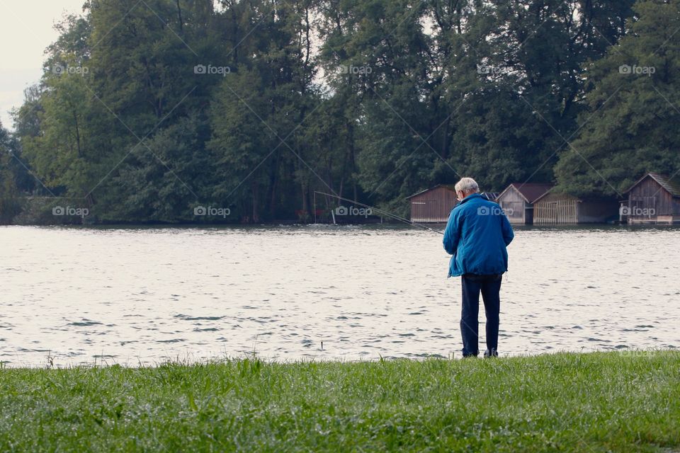 Elderly Fishing In Lake