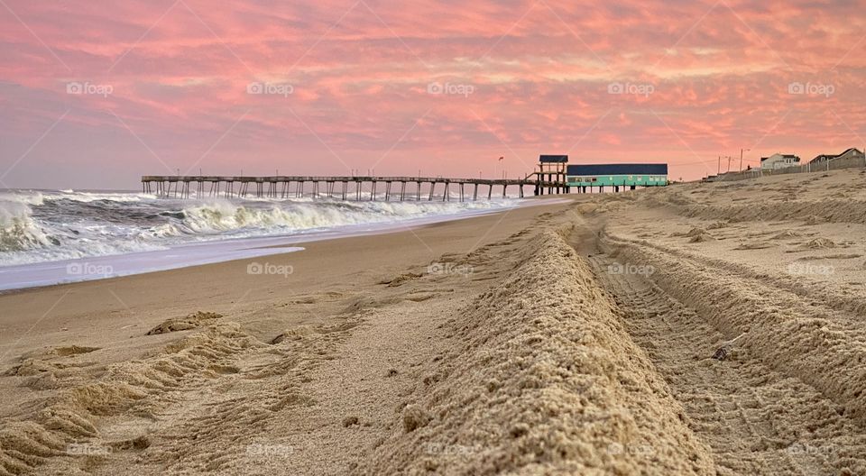Coral sky sunset at the beach with turquoise pier house 💕