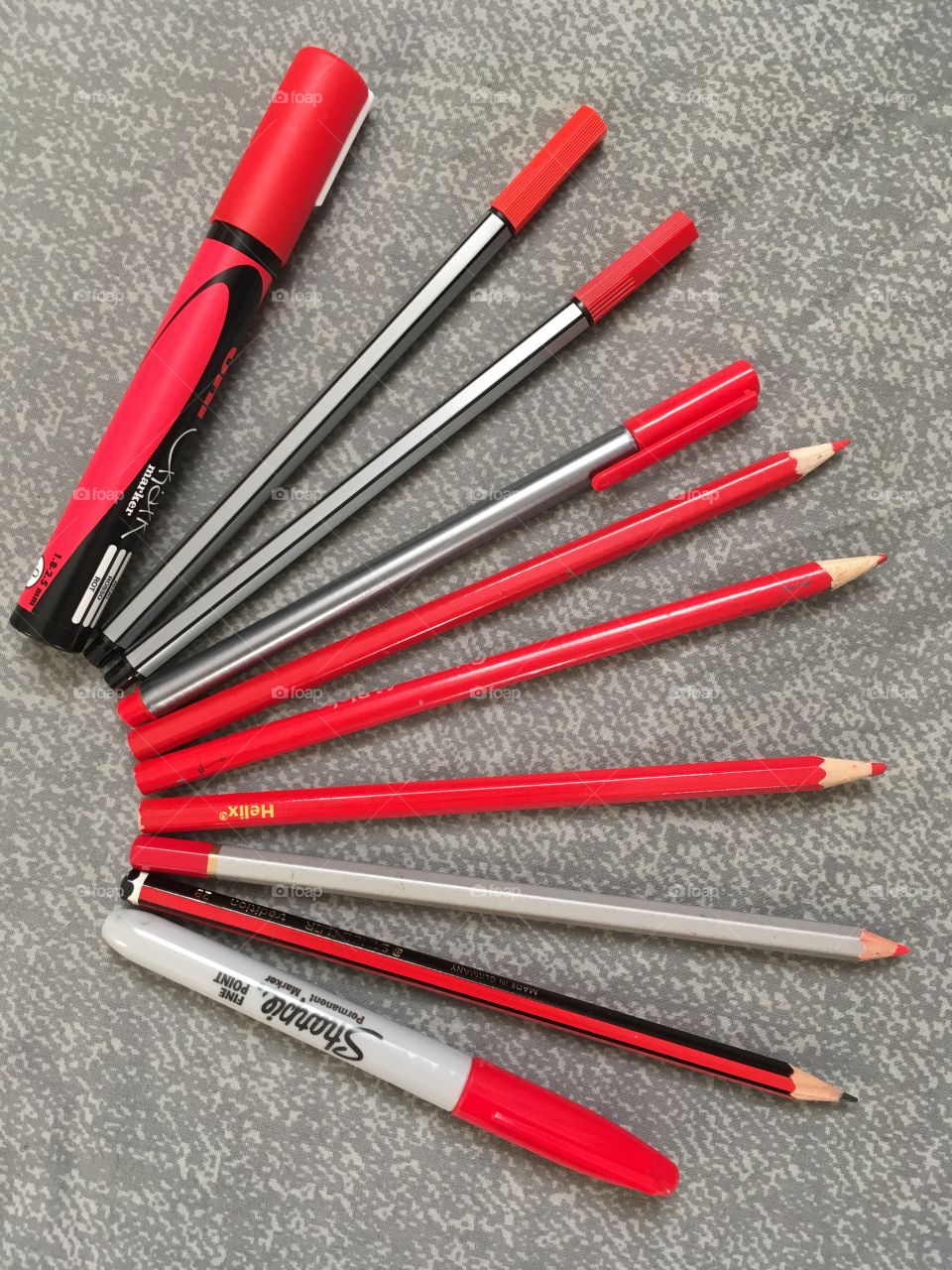 Red pencils and pens