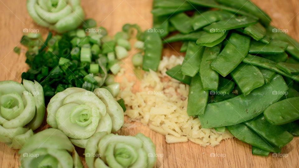 Cooking prep fresh cut vegetables on cutting board 