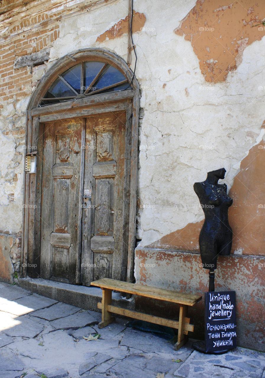 An old door, facade, figure