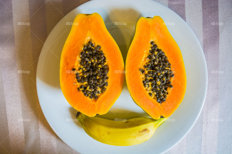 Healthy breakfast with papaya and banana