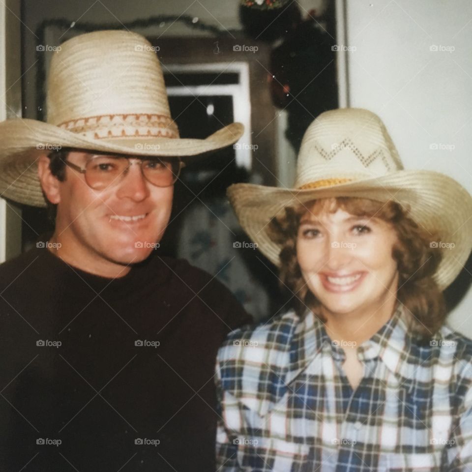 The 70s, straw cowboy hats, a happy couple