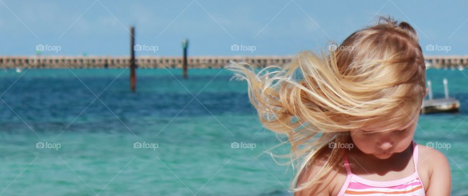 Wind blown hair at the beach