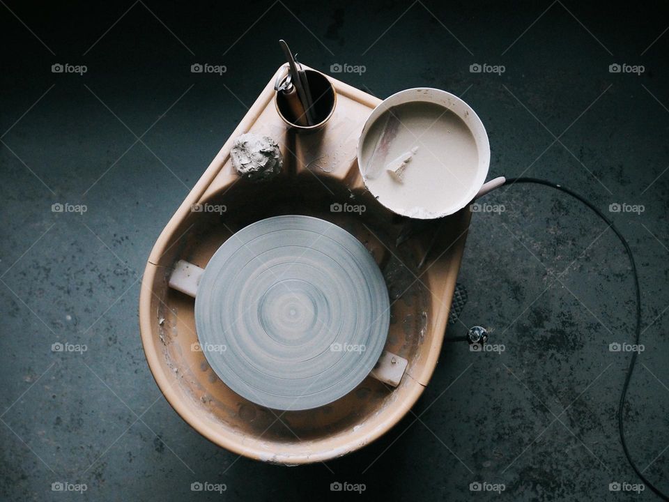 Potter's workplace, potter's wheel in the studio, top view, nobody