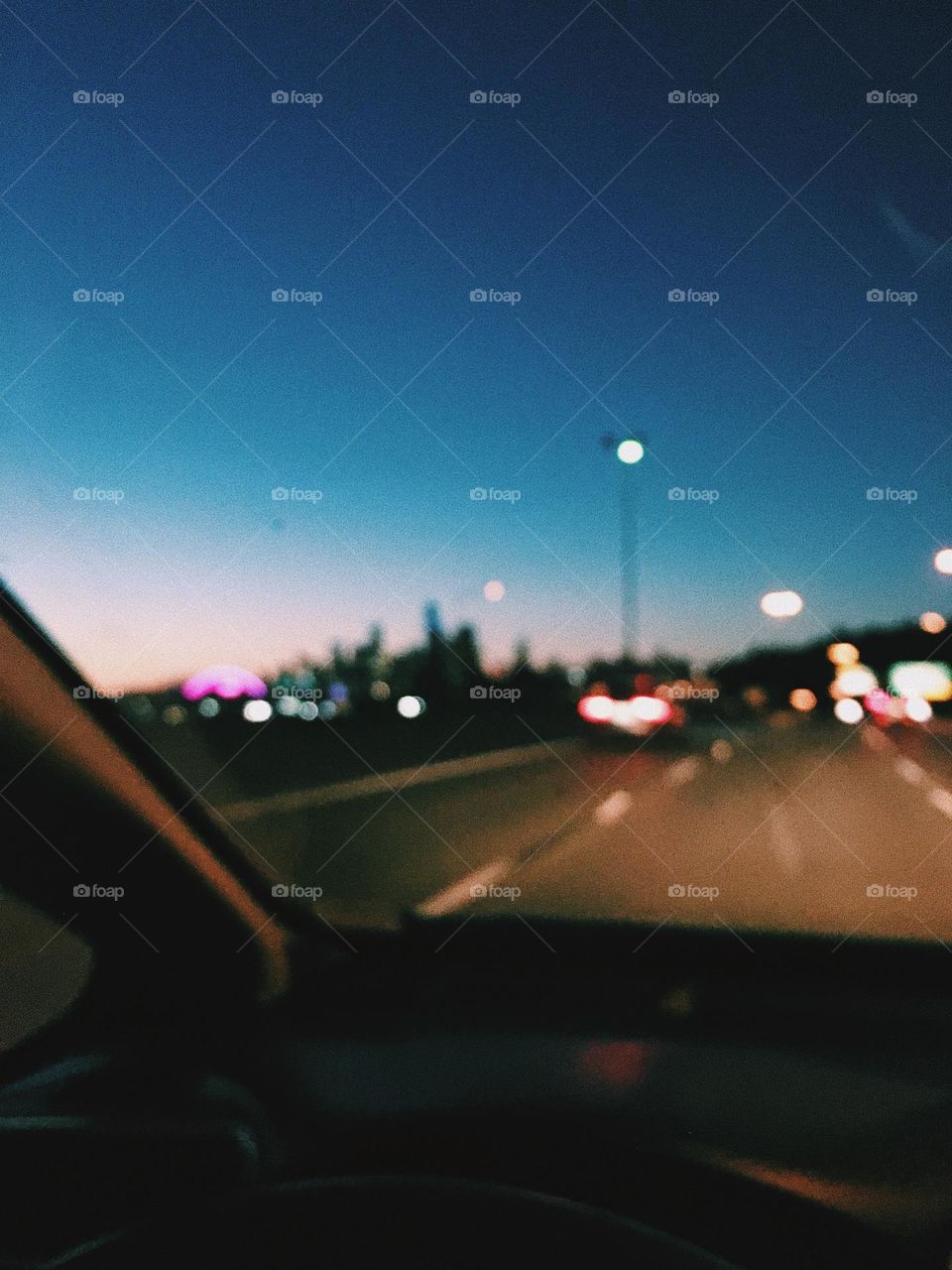 Blurred moody photo of nighttime drive in a city 