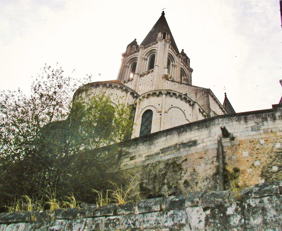 Castle in the sky. An ancient castle viewed from outside its walls in Loches, France