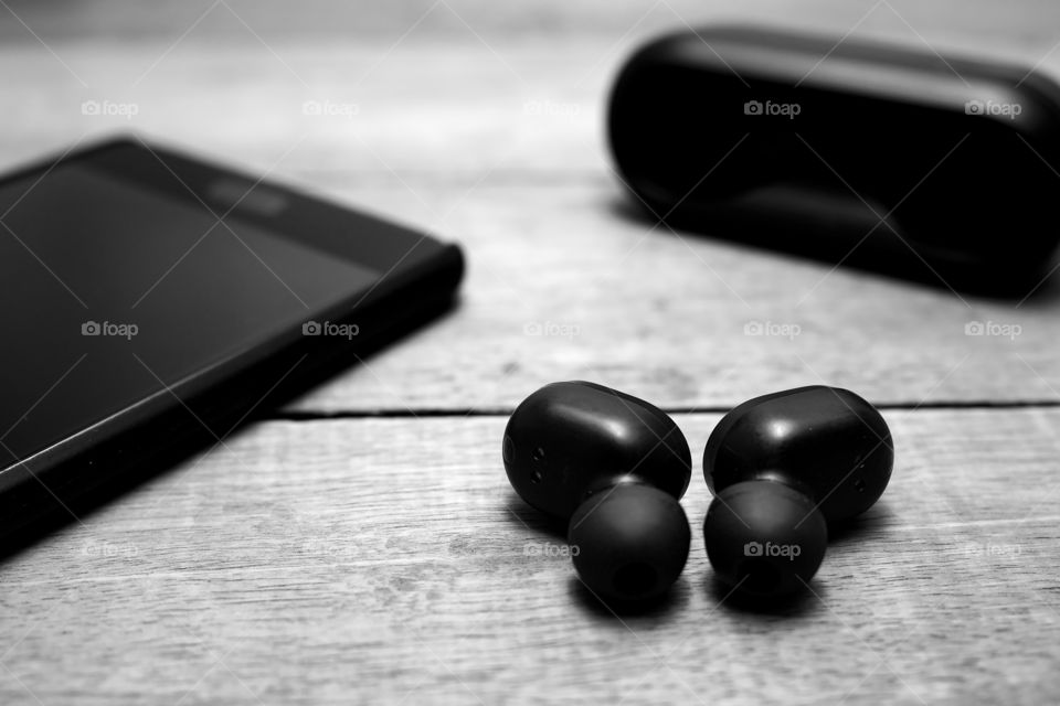 Wireless earphones in black and white color