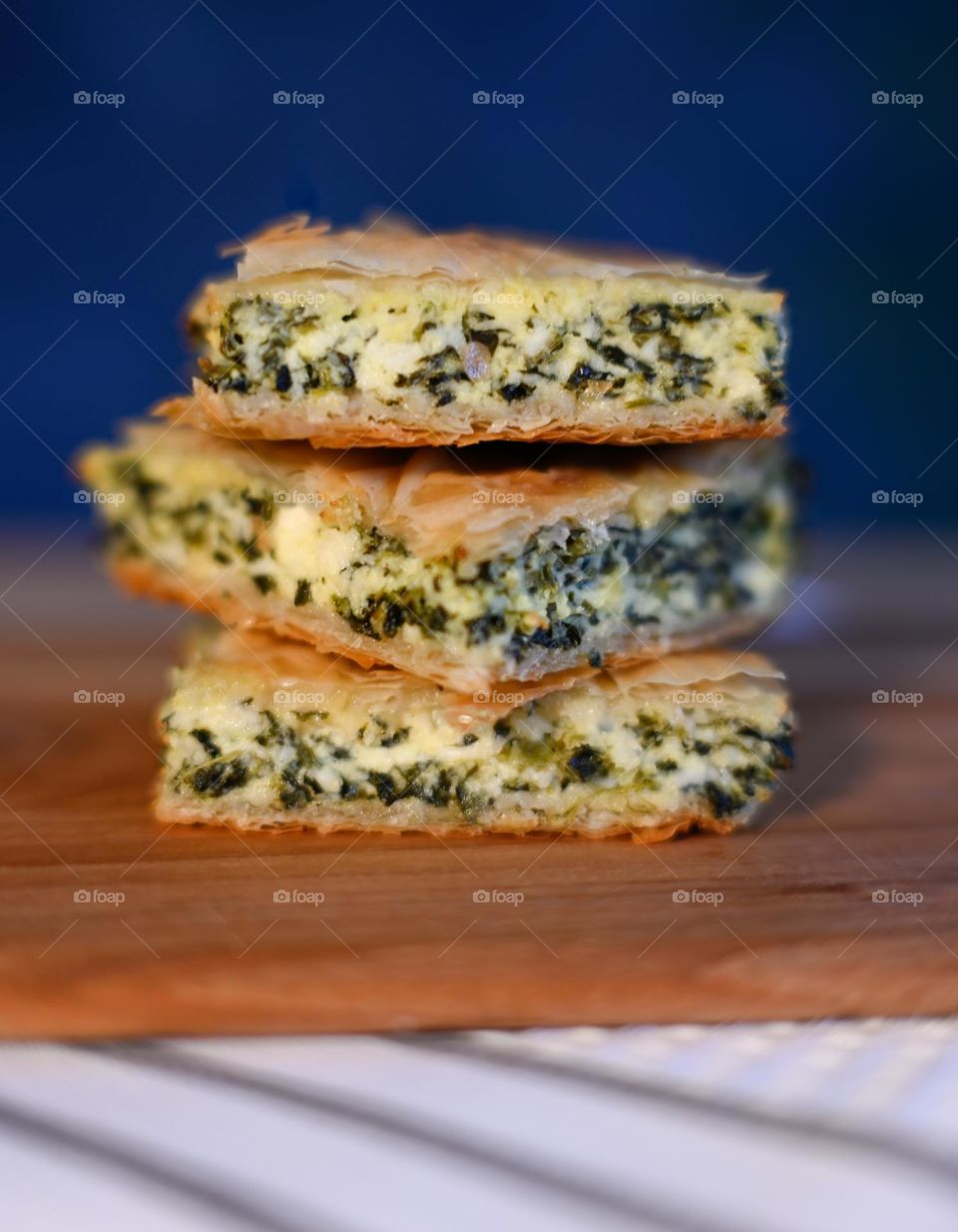 Greek spanakopita slices stacked