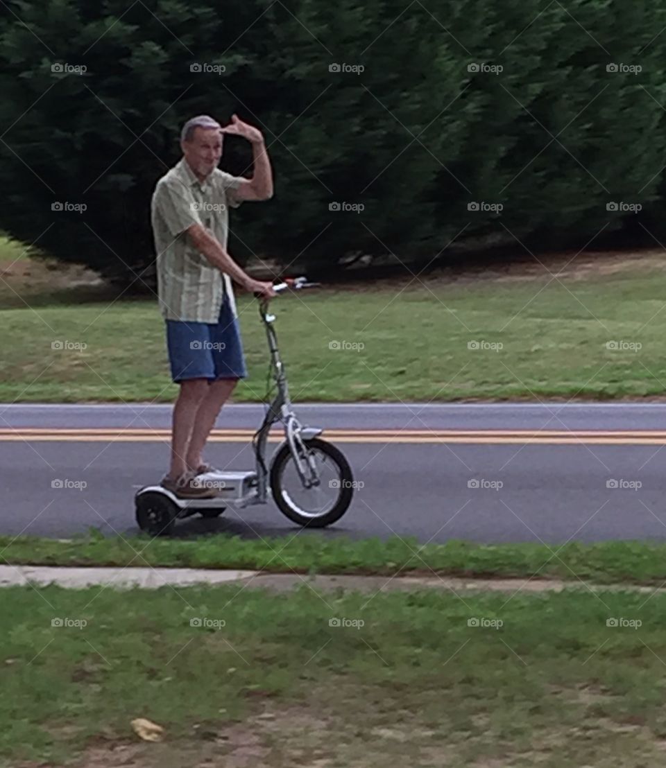 Senior man on electric cycle