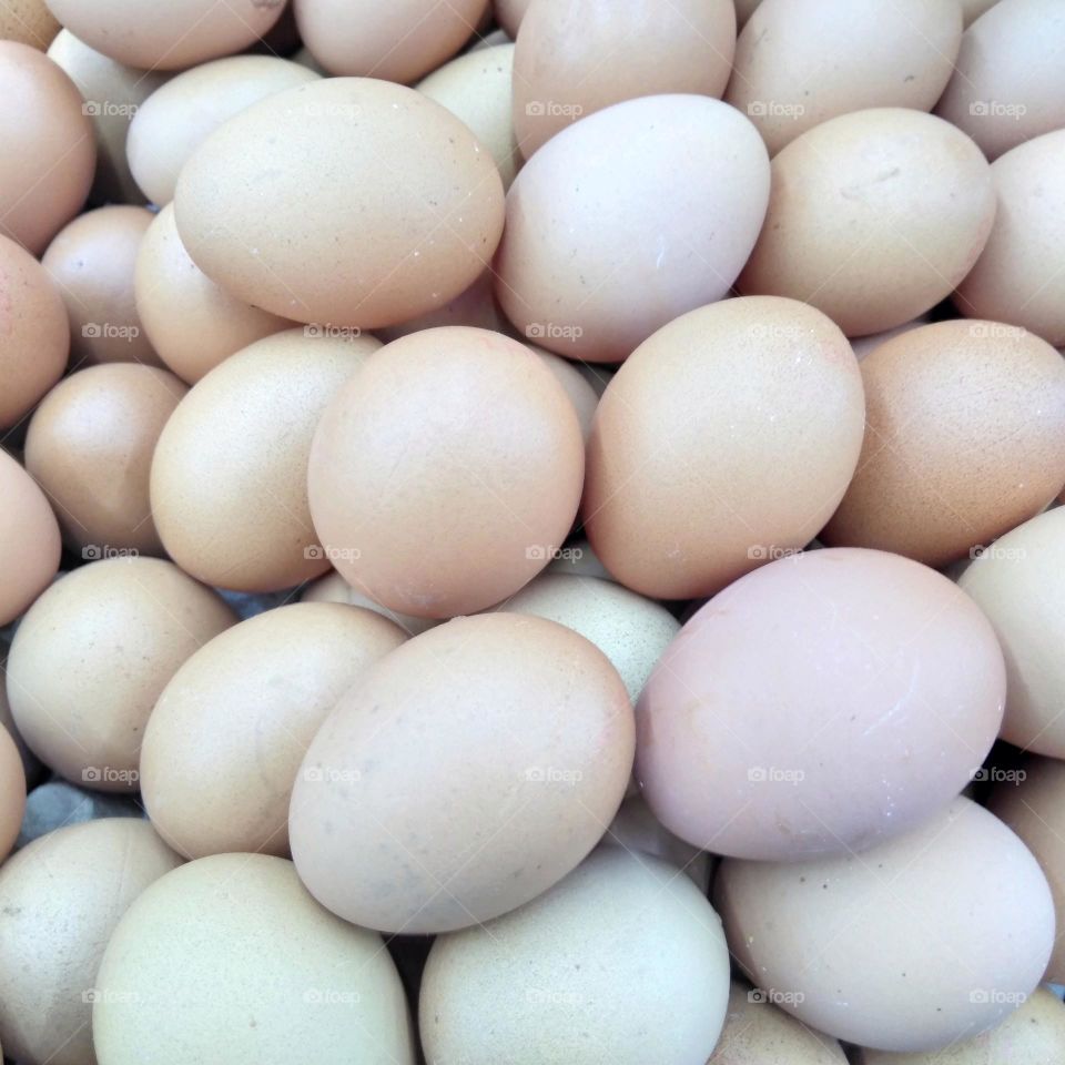 Group of chicken eggs on market