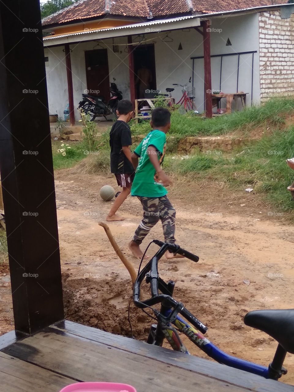 The village boy is happy to play happily