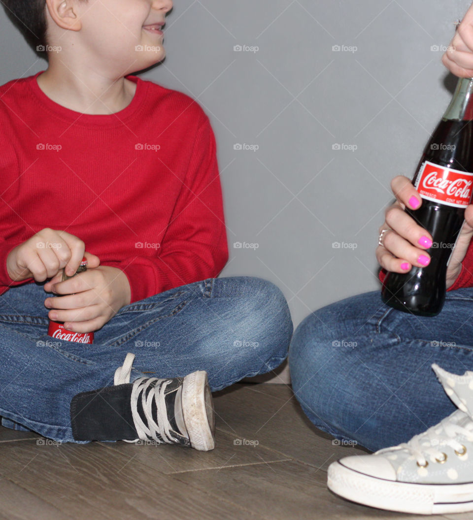 Mother and Son laughing over Coca Cola