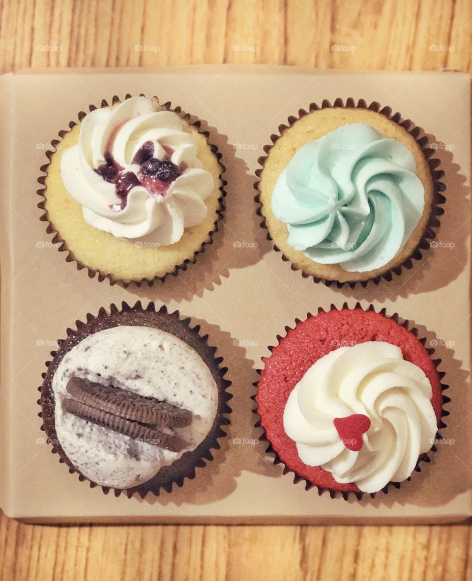love for cupcakes. four different varieties of cupcake. which one would you like to have?