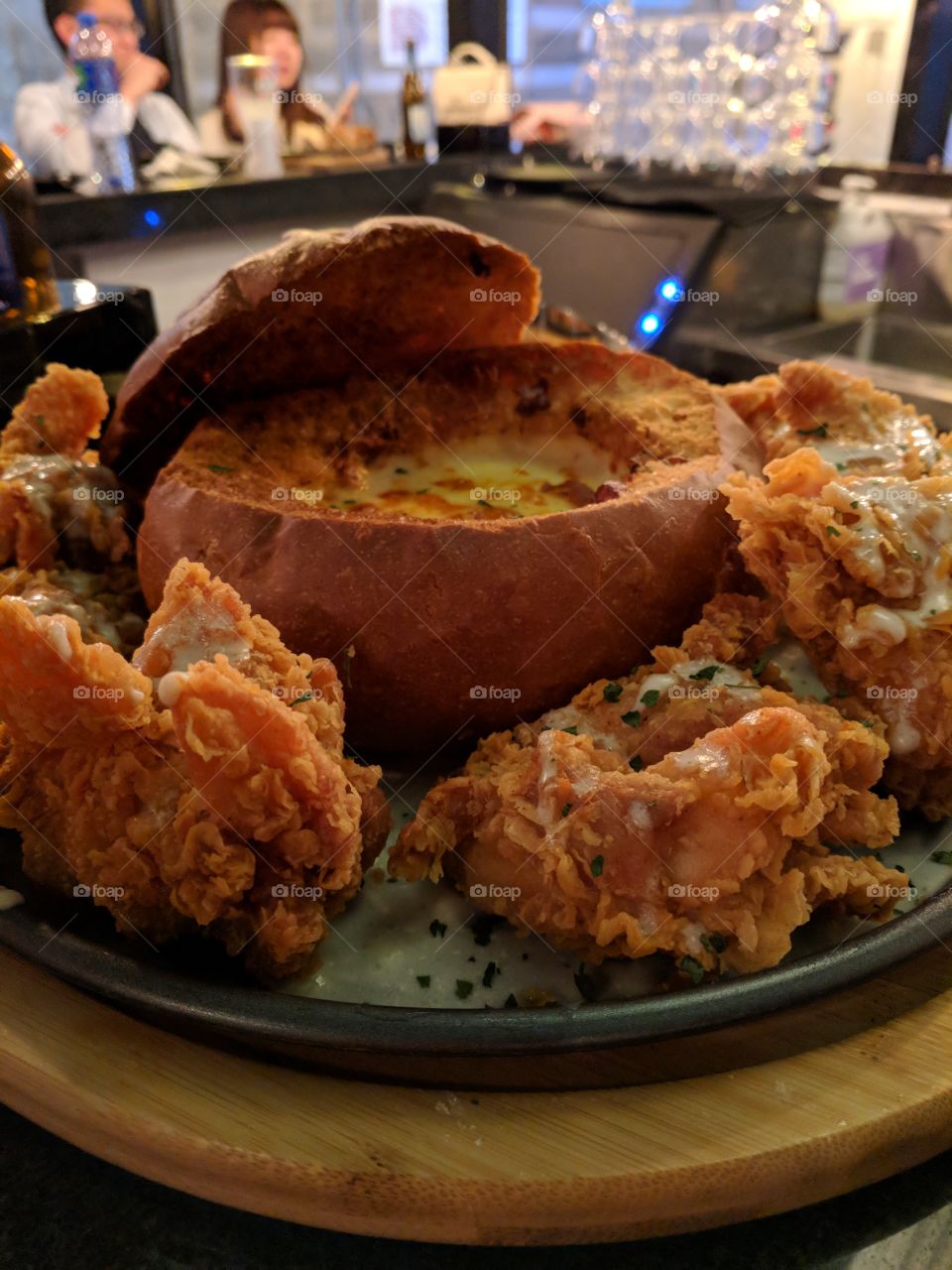 Fried chicken and cheese bread bowl