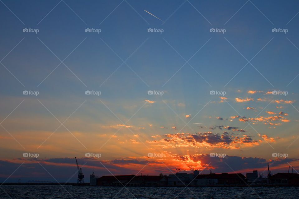 clouds sun plane greece by jnen