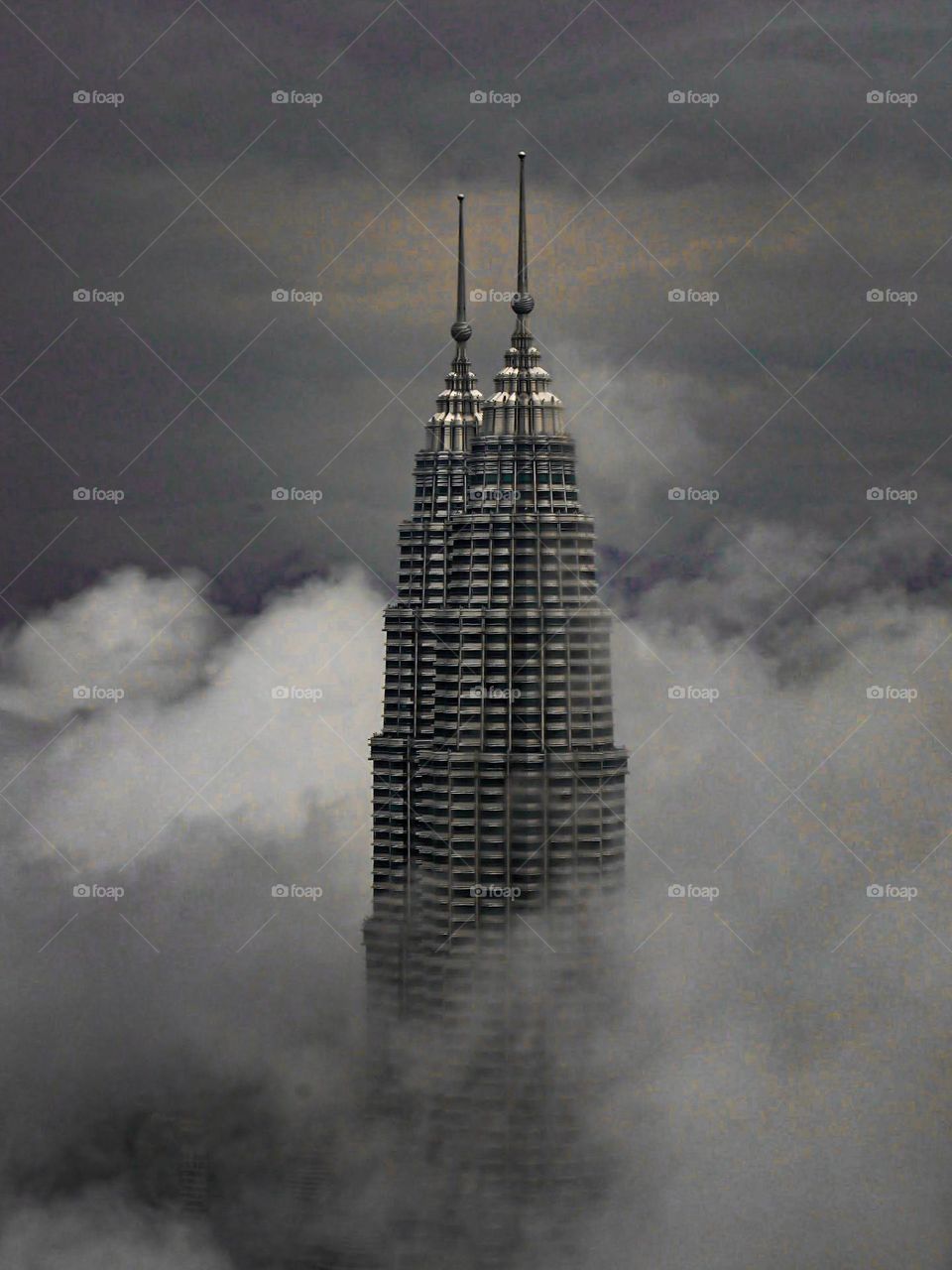 Kuala Lumpur City Centre is like floating because it is covered by clouds