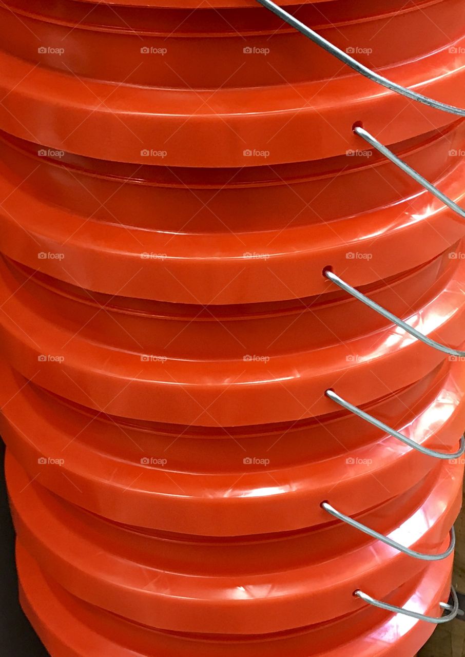 Clean orange buckets in a stack