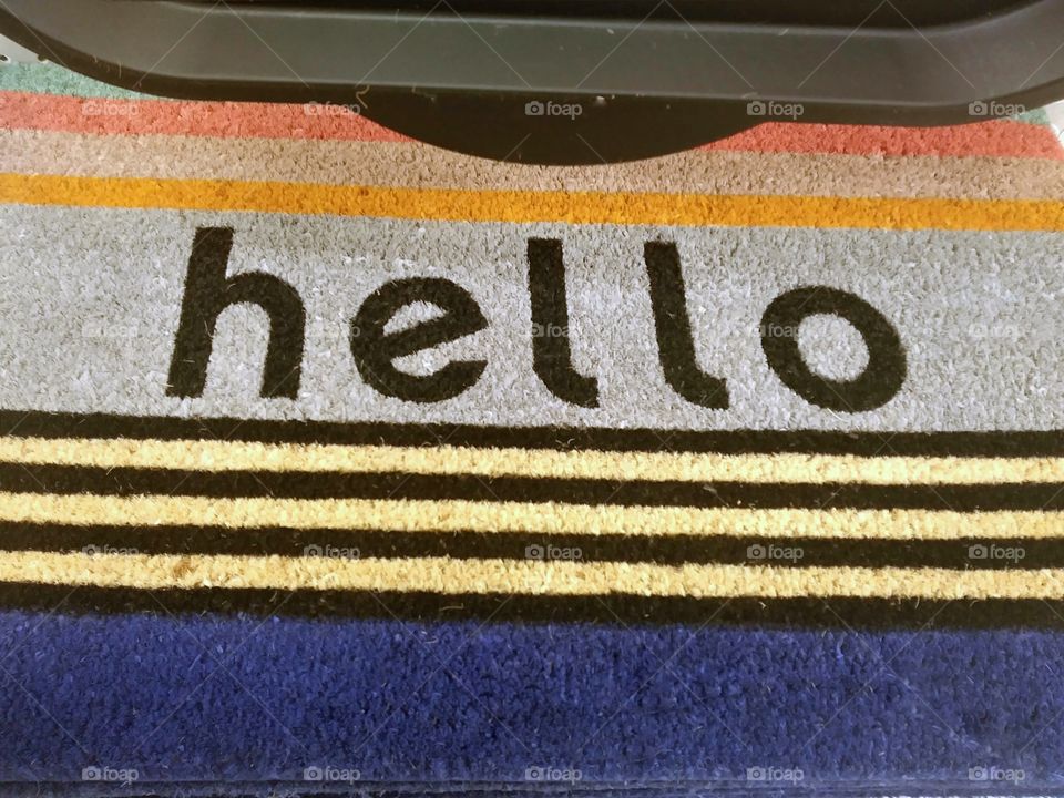Welcome mat that says "hello"