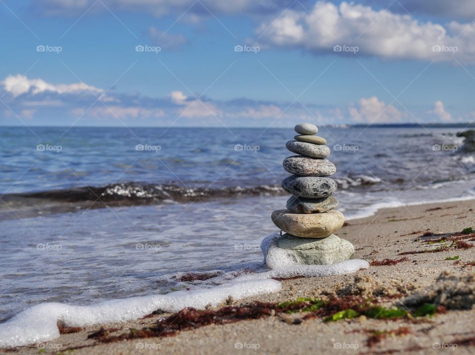 Stacked stones on shore